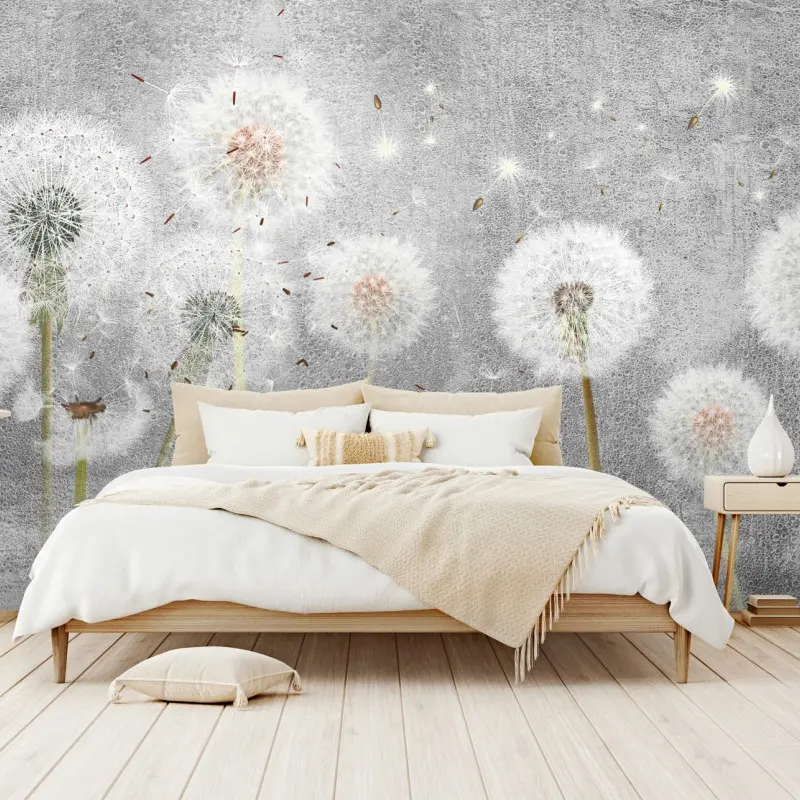 Wall mural delicate dandelion seeds on textured gray background