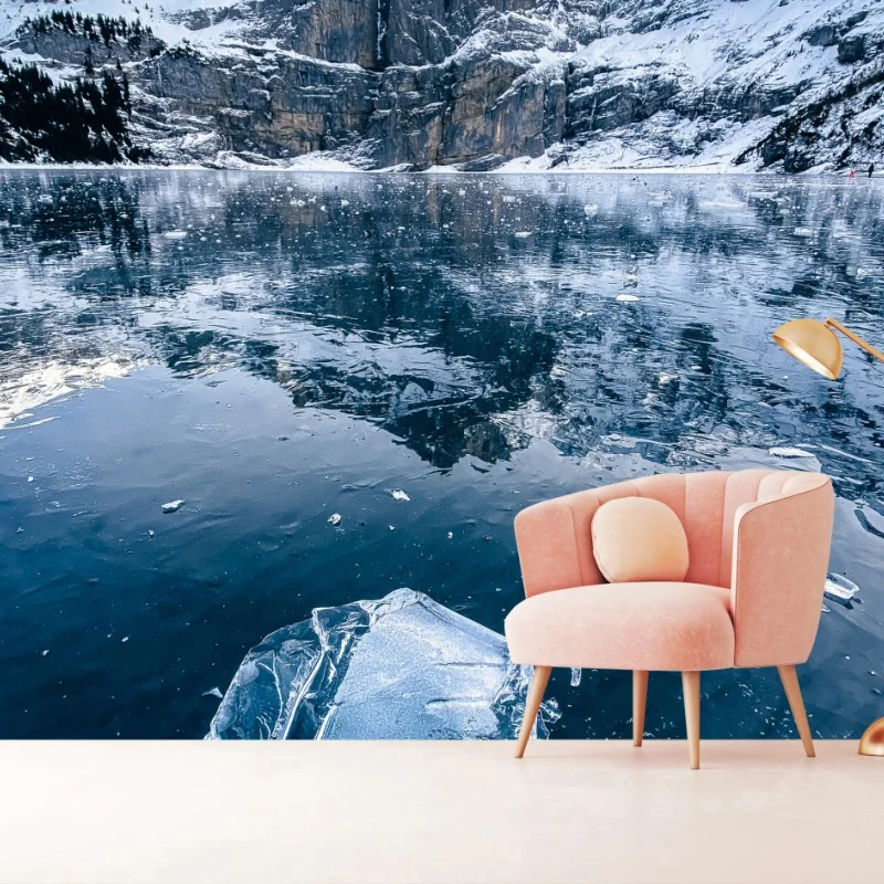 Wall mural clear ice on Oeschinensee with alpine reflection