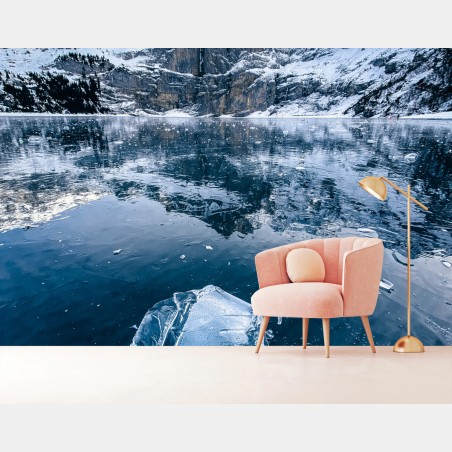 Wall mural clear ice on Oeschinensee with alpine reflection • Wallissimo®