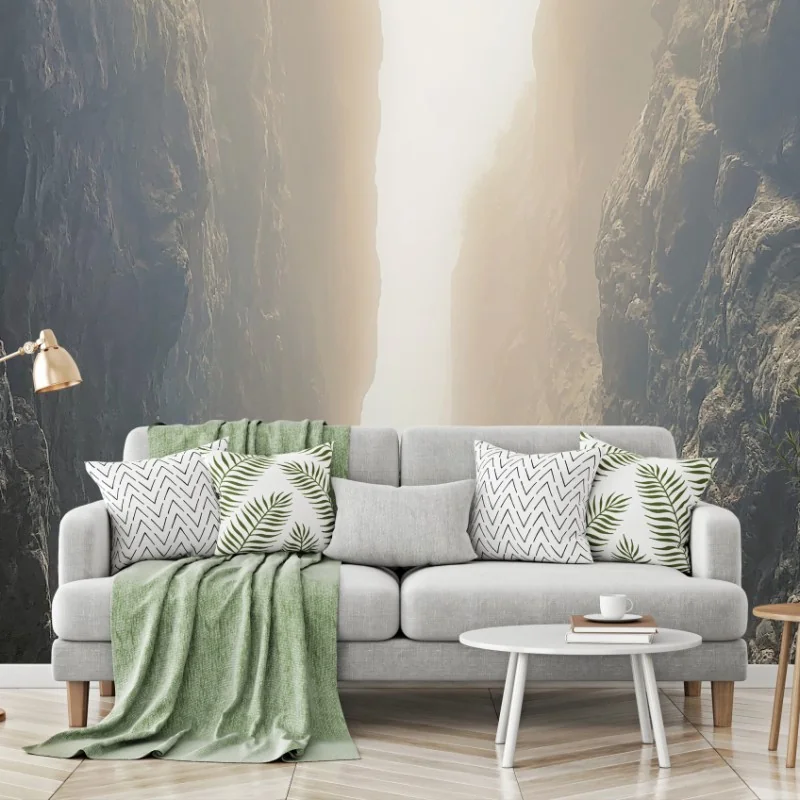 Wall mural sunlit narrow canyon between towering cliffs