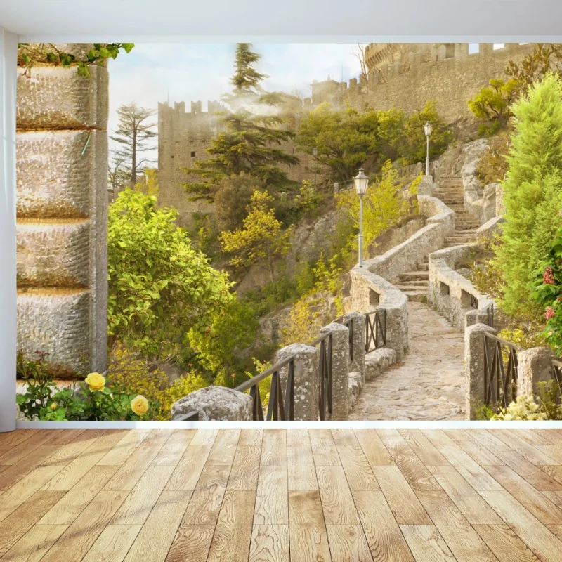 Wall mural sunlit garden path to castle