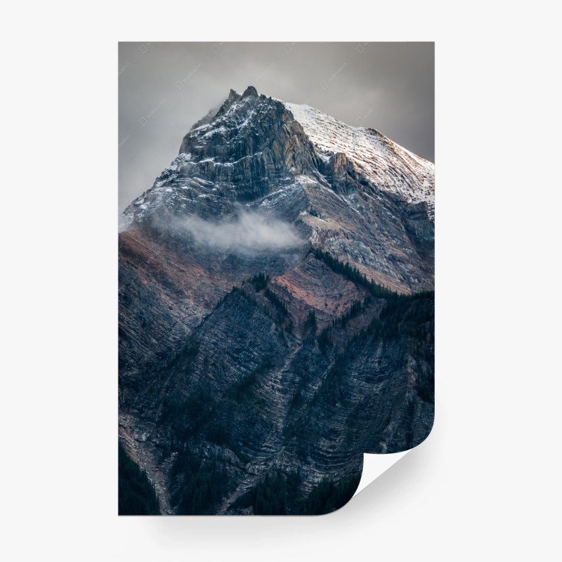 Wall mural dramatic alpine peak in mist