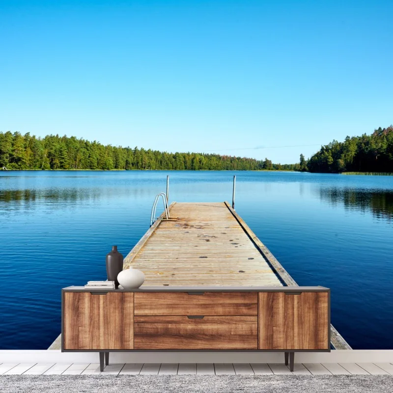 Wall mural tranquil lake pier with forest reflections