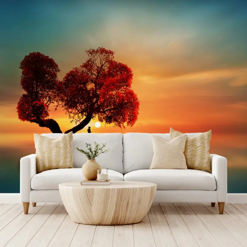 Wall mural solitary red tree at sunset