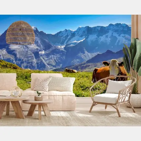 Wall mural alpine meadow with resting cow • Wallissimo®