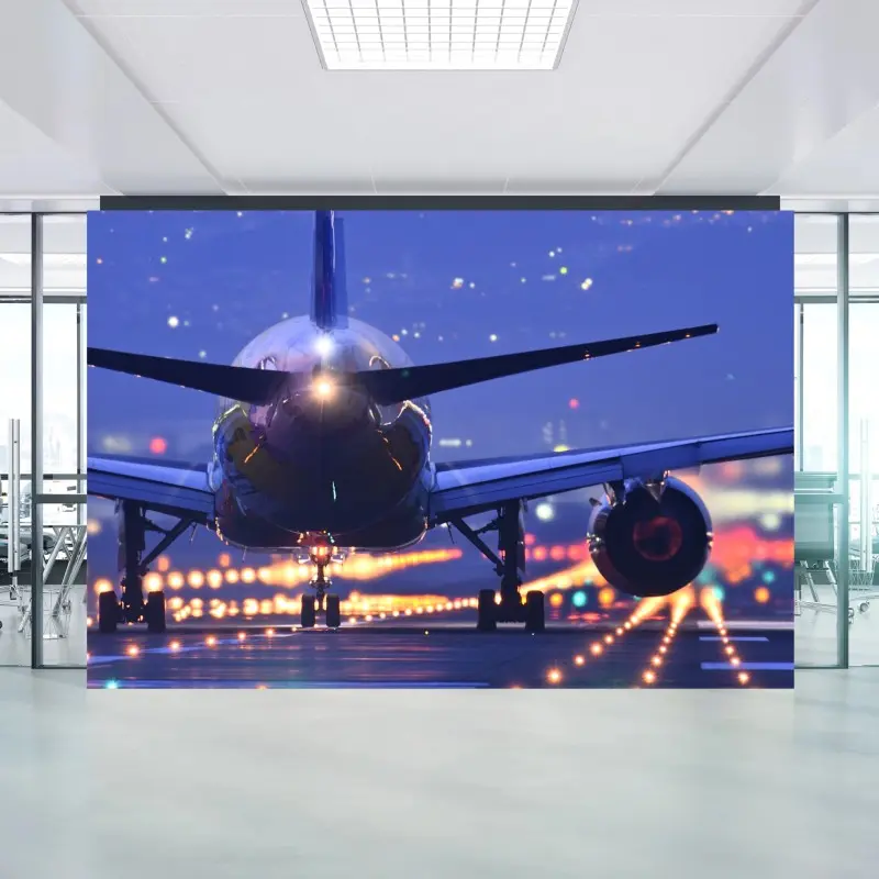Wall mural airplane on runway at dusk