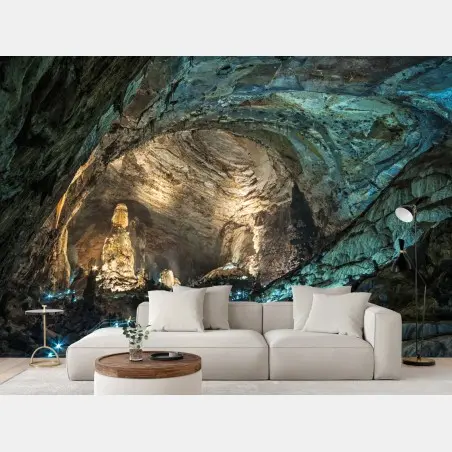 Wall mural illuminated cave interior with towering stalagmites • Wallissimo®