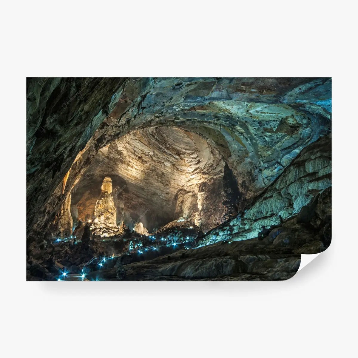 Wall mural illuminated cave interior with towering stalagmites • Wallissimo®