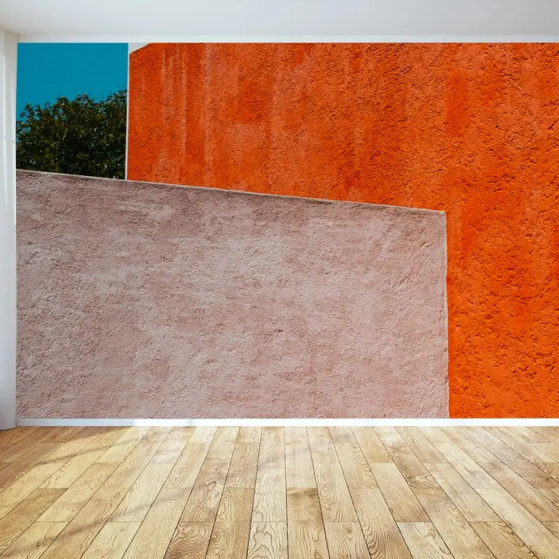 Wall mural bold geometric facade in orange and turquoise