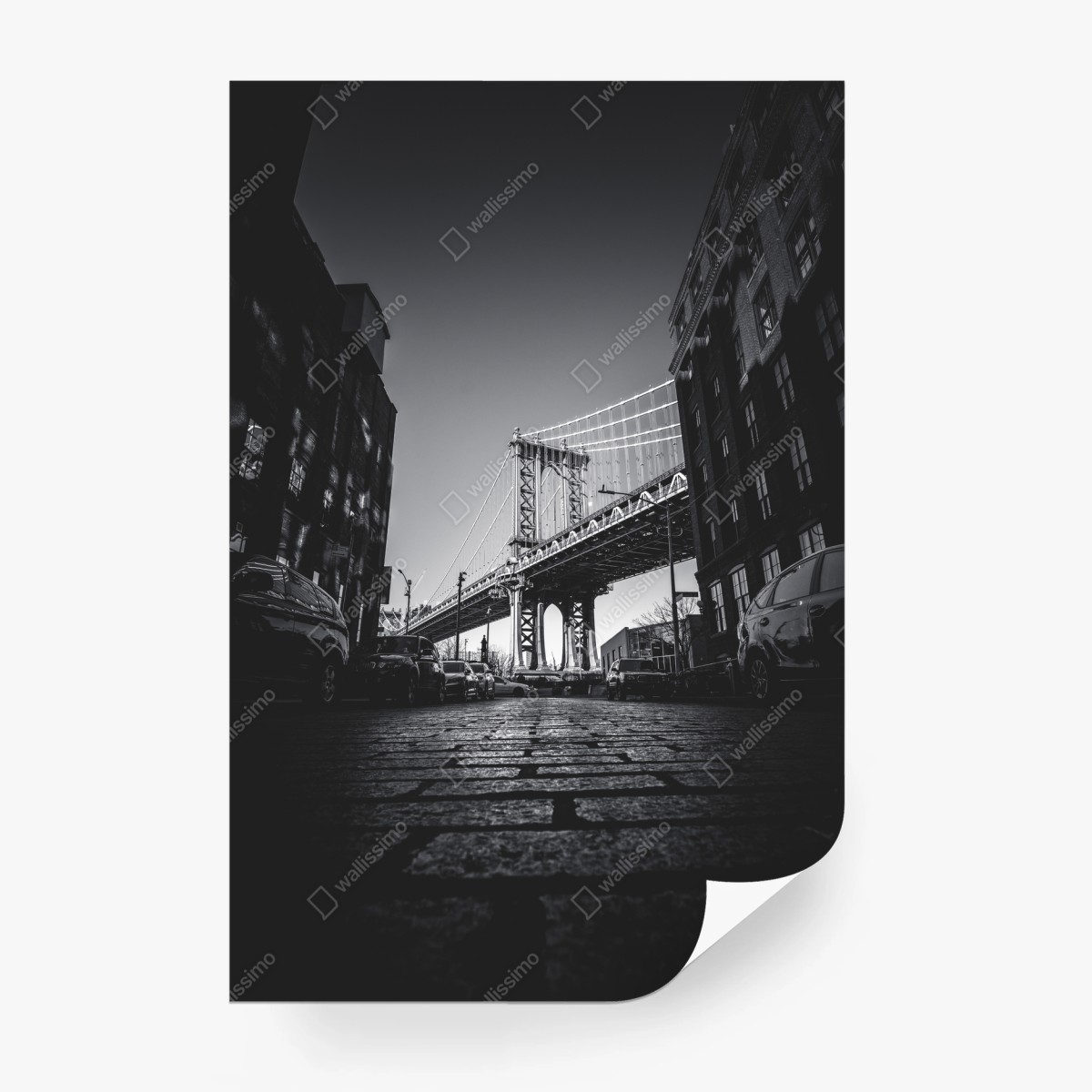 Wall mural Manhattan bridge perspective over cobblestone street • Wallissimo®