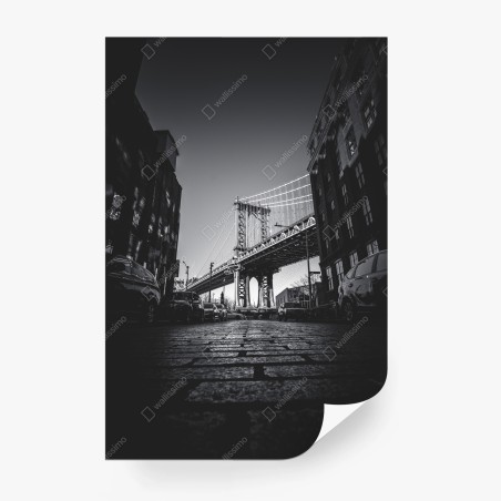 Wall mural Manhattan bridge perspective over cobblestone street • Wallissimo®