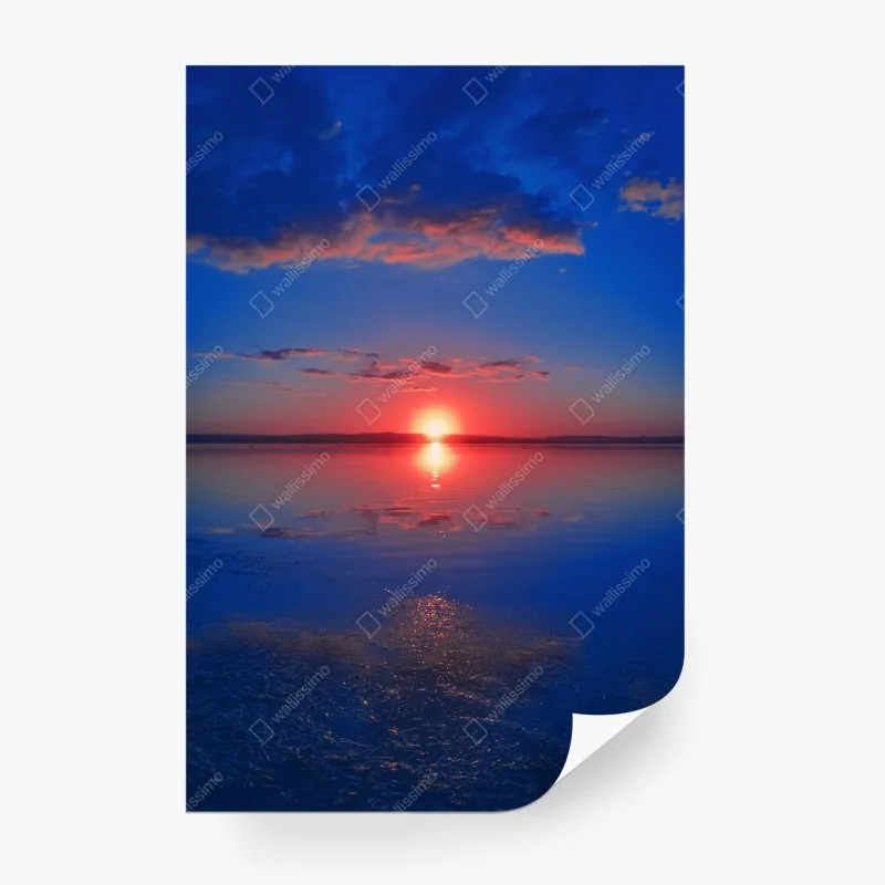 Wall mural sunset over calm sea with vivid reflection