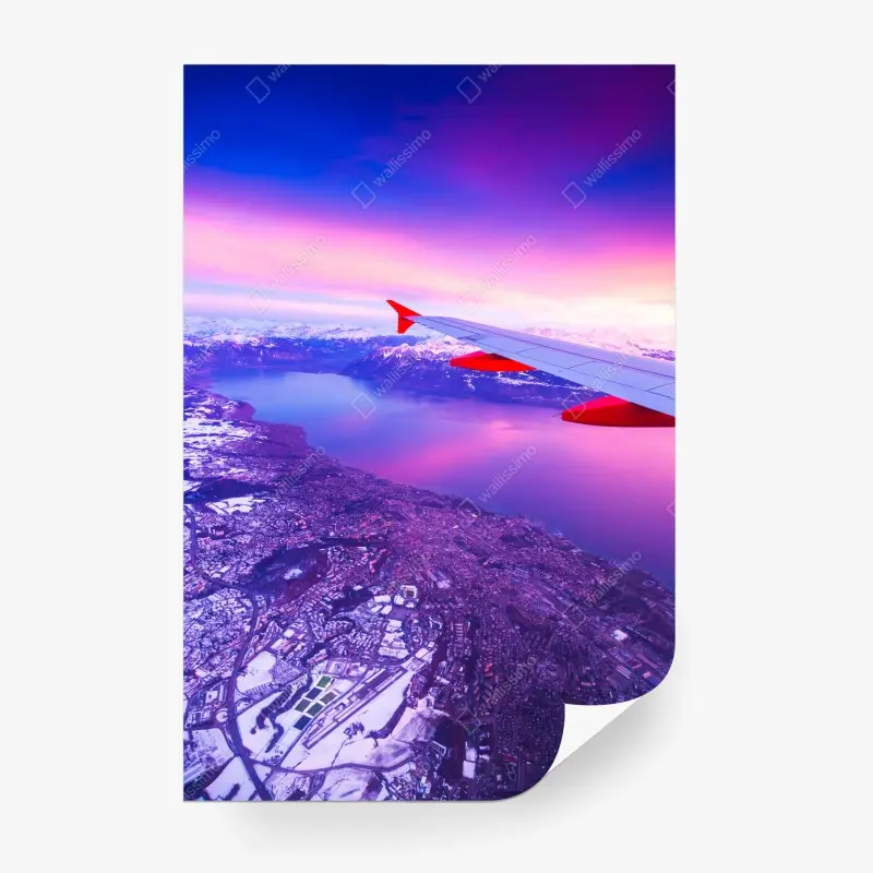 Wall mural aerial cityscape above lake at sunset