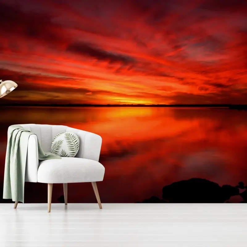 Wall mural fiery red sunset over still lake