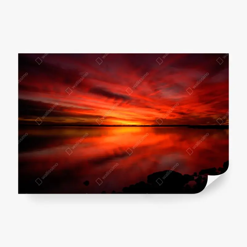 Wall mural fiery red sunset over still lake