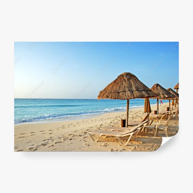 Wall mural tropical beach with straw umbrellas