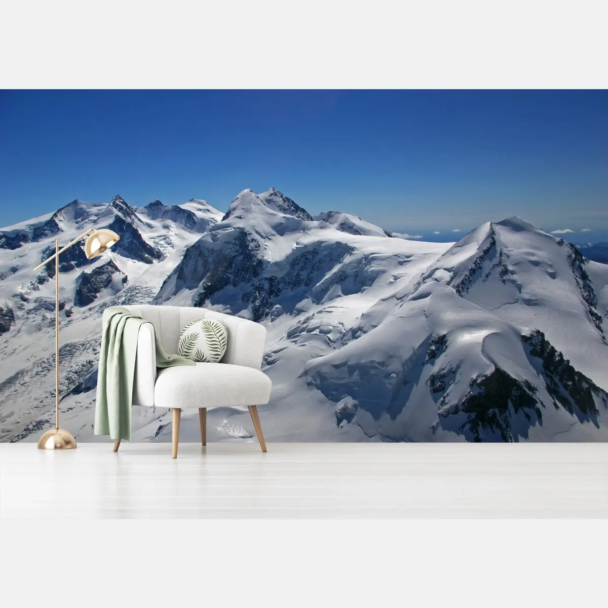 Wall mural snow-covered alpine peaks under clear blue sky • Wallissimo®