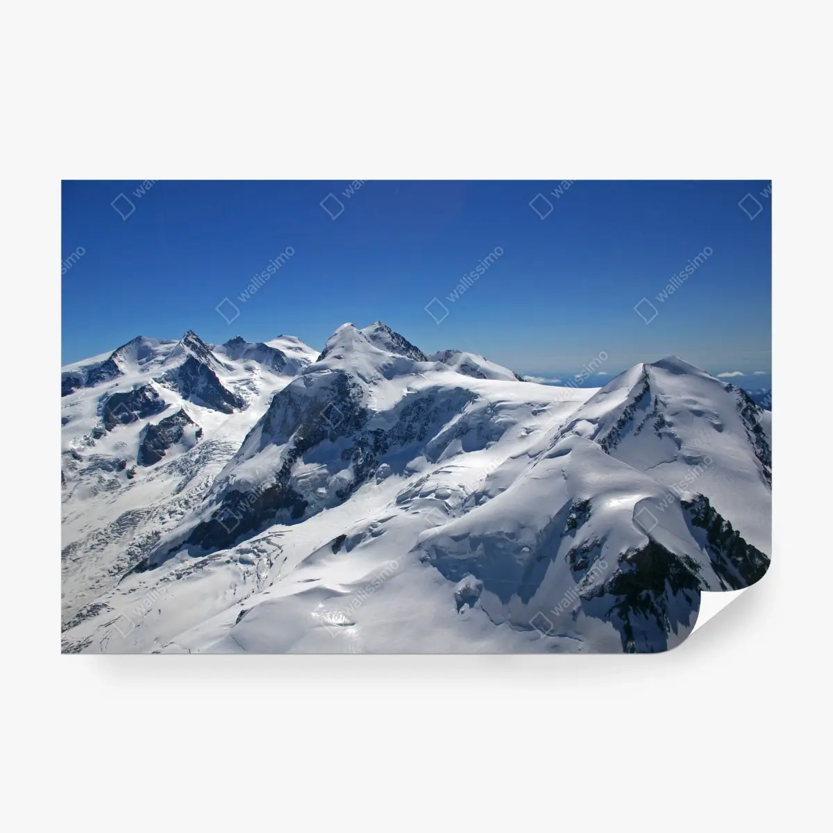 Wall mural snow-covered alpine peaks under clear blue sky • Wallissimo®