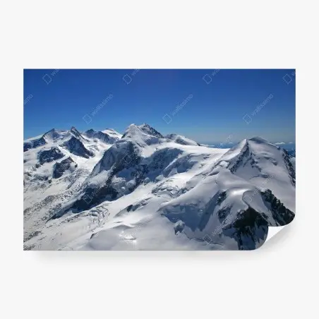 Wall mural snow-covered alpine peaks under clear blue sky • Wallissimo®