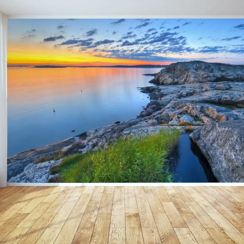 Wall mural tranquil coastal sunset over rocky shore