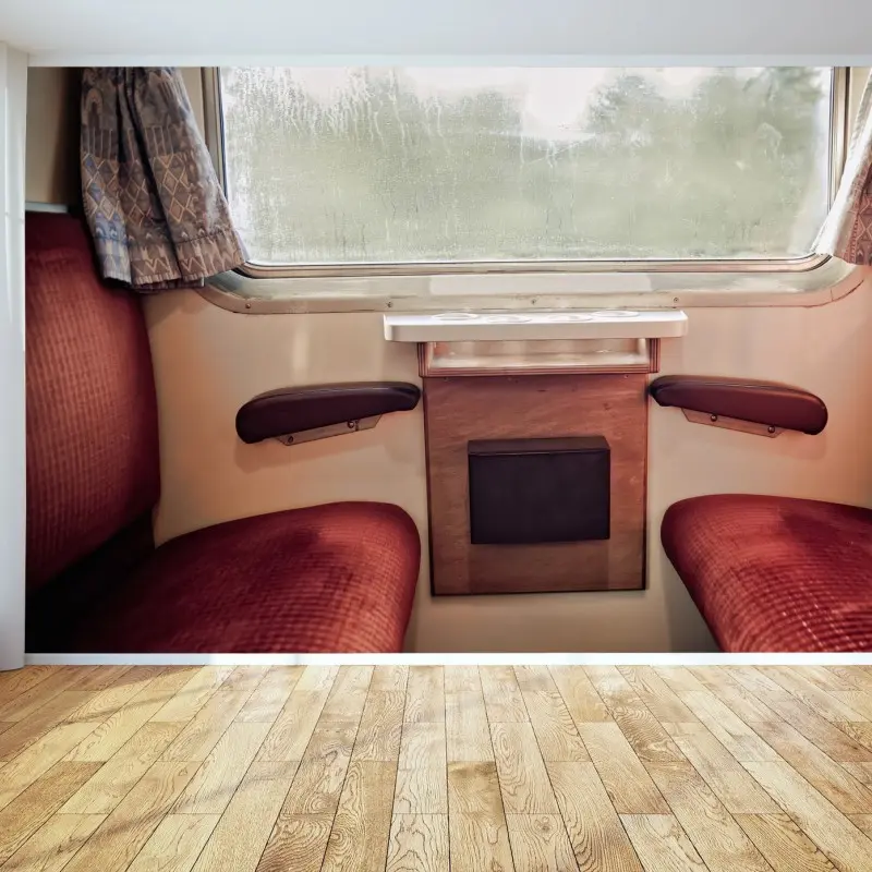 Wall mural vintage train compartment with rainy window