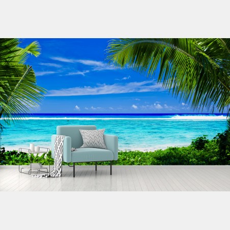 Wall mural tropical lagoon framed by palm trees • Wallissimo®