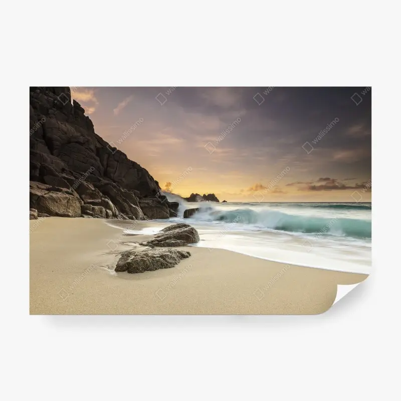 Wall mural serene rocky beach at sunset