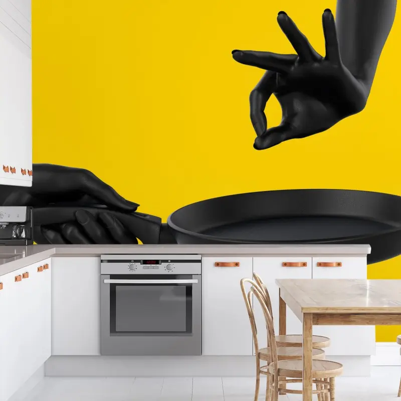 Wall mural black hands with frying pan on yellow