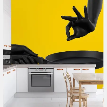 Wall mural black hands with frying pan on yellow • Wallissimo®
