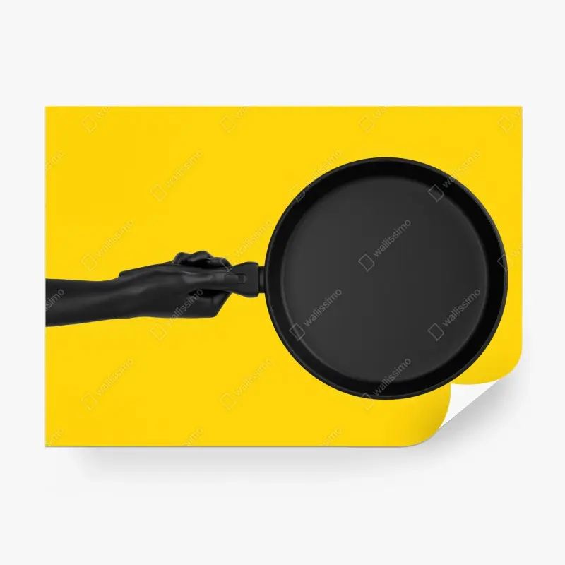 Wall mural black pan on vibrant yellow background