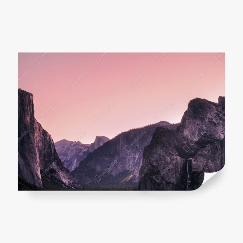 Wall mural pink dusk over mountain valley