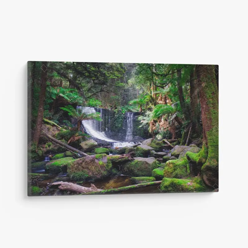Canvas print moss-covered waterfall in lush forest